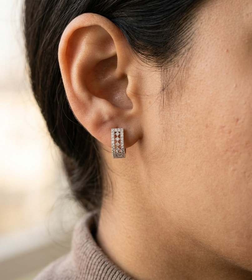 18K white gold diamond hoop earrings featuring 0.30 carat natural diamonds in a modern rectangular hoop design with hinged closures.