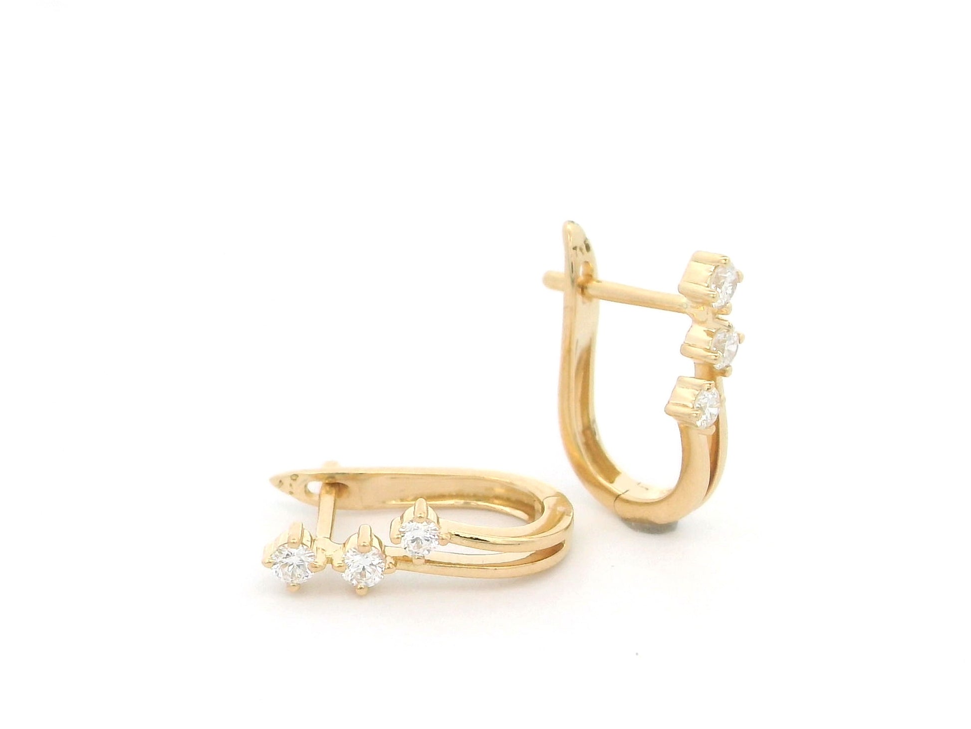 18K Yellow Gold Diamond Hoop Earrings featuring three natural diamonds on each hoop with a modern double-row huggie design.