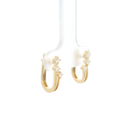 18K Yellow Gold Diamond Hoop Earrings featuring three natural diamonds on each hoop with a modern double-row huggie design.