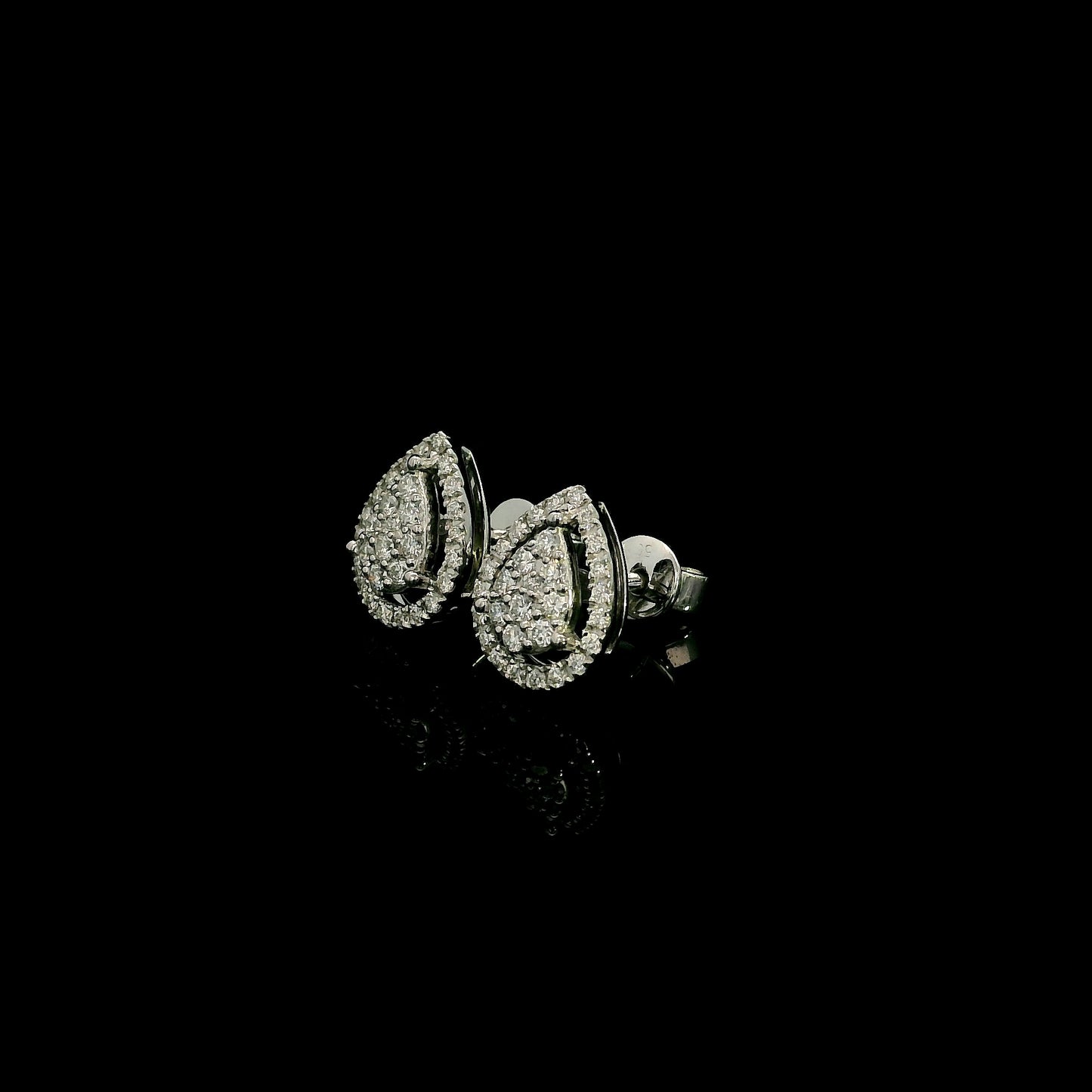 18K white gold diamond stud earrings featuring a pear-shaped cluster of natural diamonds surrounded by a sparkling diamond halo.