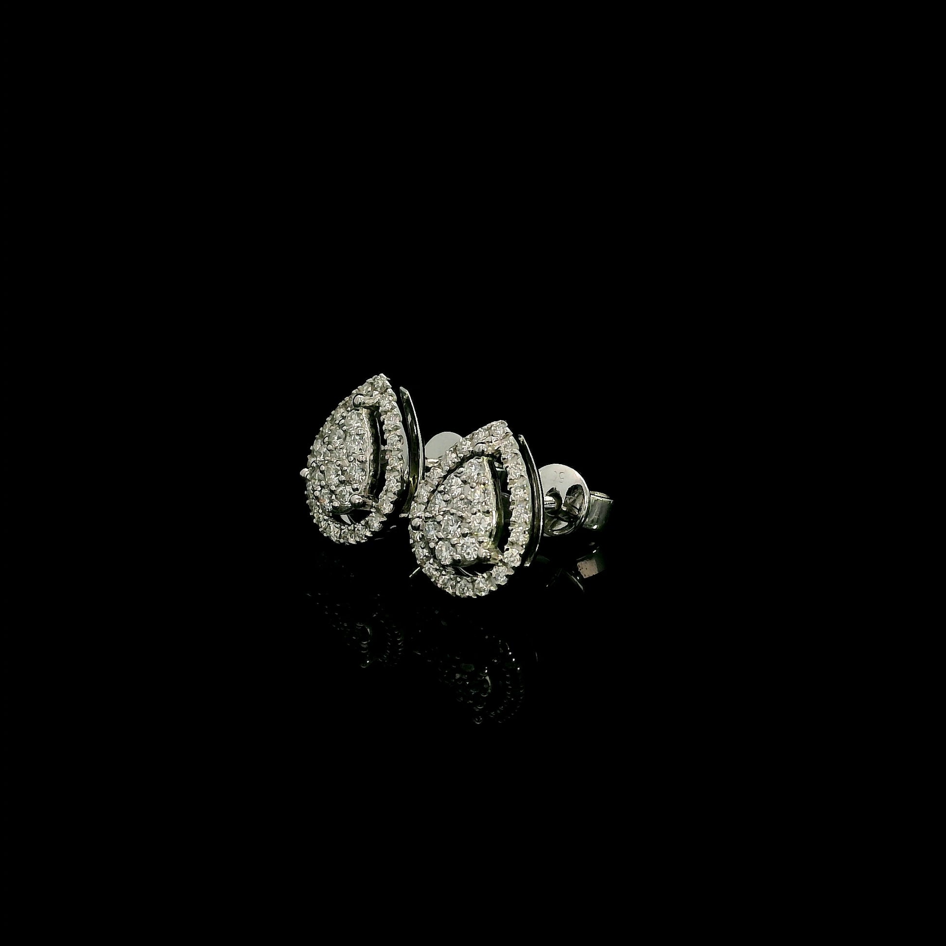 18K white gold diamond stud earrings featuring a pear-shaped cluster of natural diamonds surrounded by a sparkling diamond halo.
