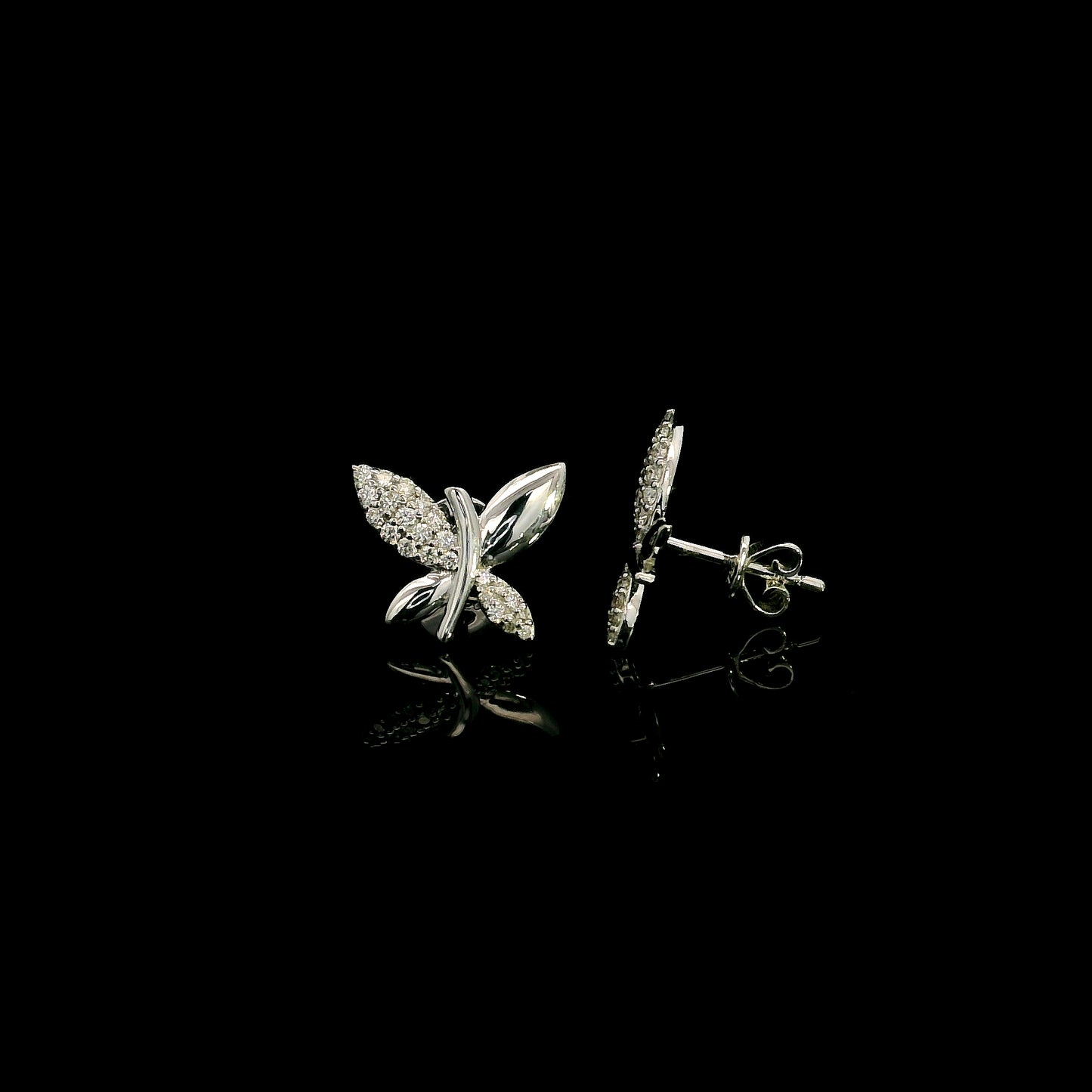 18K white gold butterfly stud earrings featuring 0.24 carat natural round brilliant diamonds with polished white gold wings.