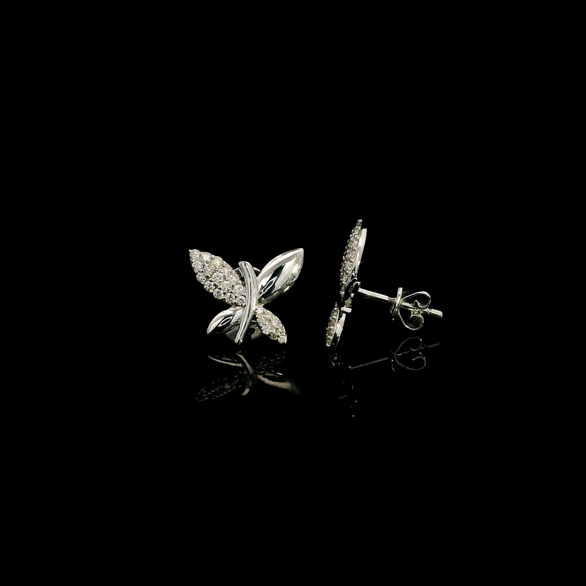 18K white gold butterfly stud earrings featuring 0.24 carat natural round brilliant diamonds with polished white gold wings.