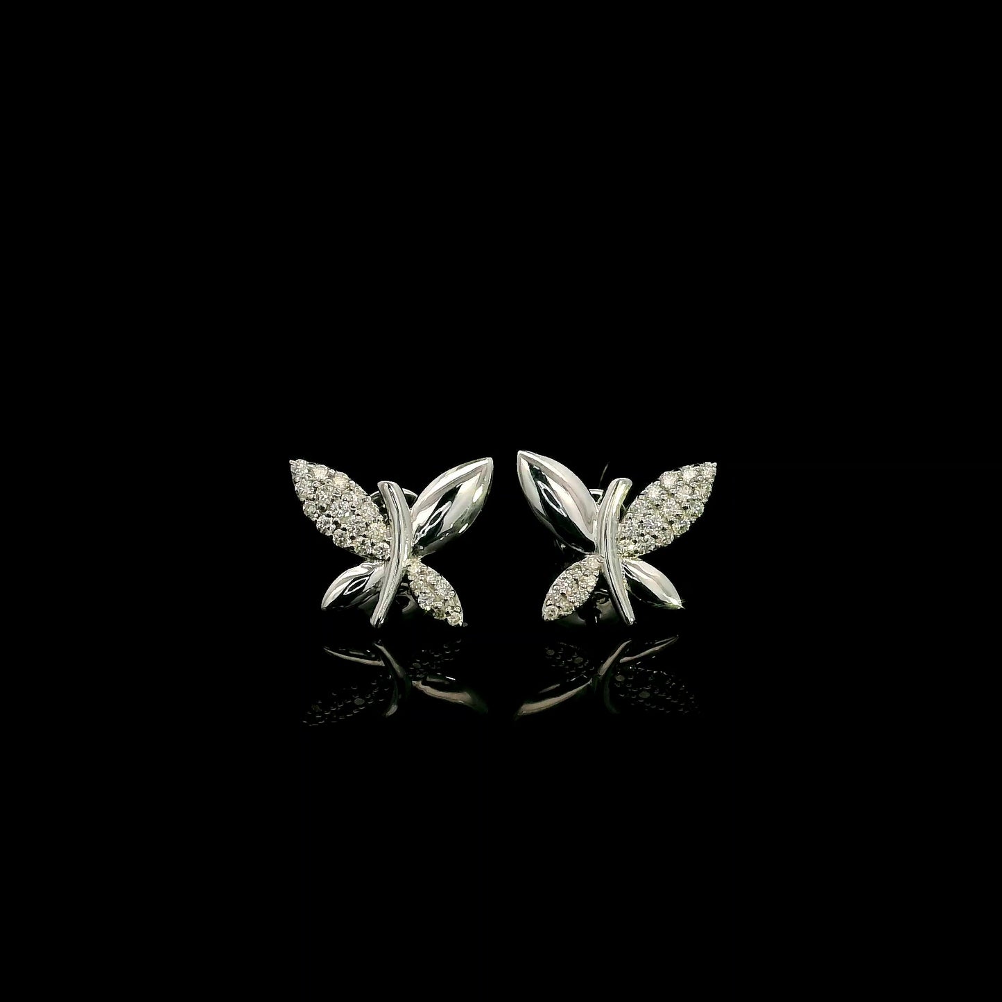 18K white gold butterfly stud earrings featuring 0.24 carat natural round brilliant diamonds with polished white gold wings.