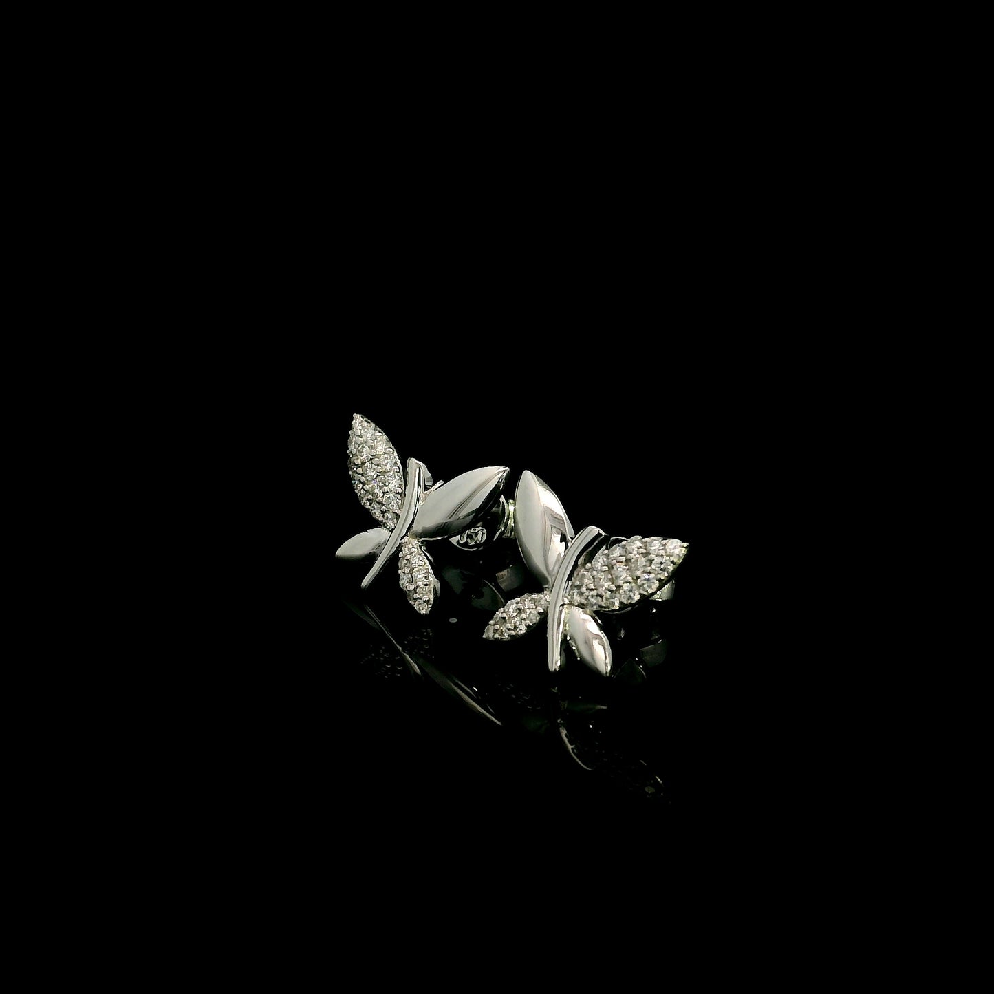 18K white gold butterfly stud earrings featuring 0.24 carat natural round brilliant diamonds with polished white gold wings.