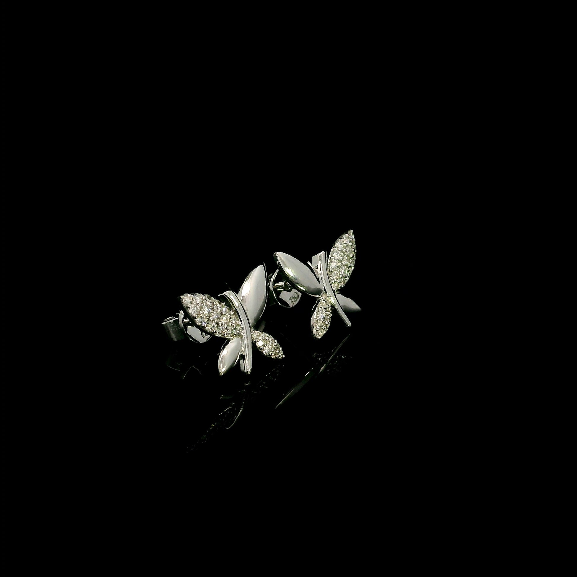 18K white gold butterfly stud earrings featuring 0.24 carat natural round brilliant diamonds with polished white gold wings.