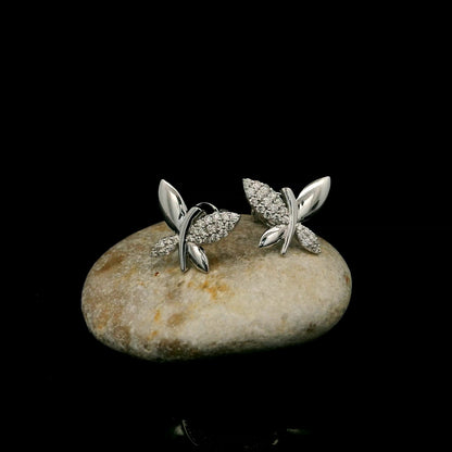 18K white gold butterfly stud earrings featuring 0.24 carat natural round brilliant diamonds with polished white gold wings.
