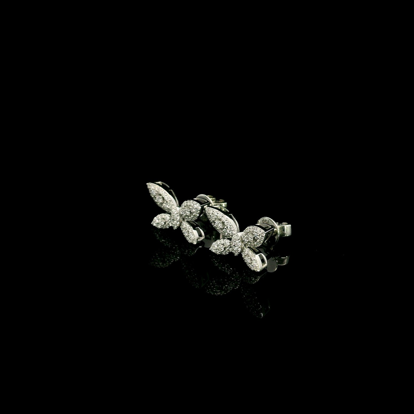 18K white gold butterfly stud earrings featuring 0.45 carat natural round brilliant diamonds in a pavé setting with secure butterfly backs.