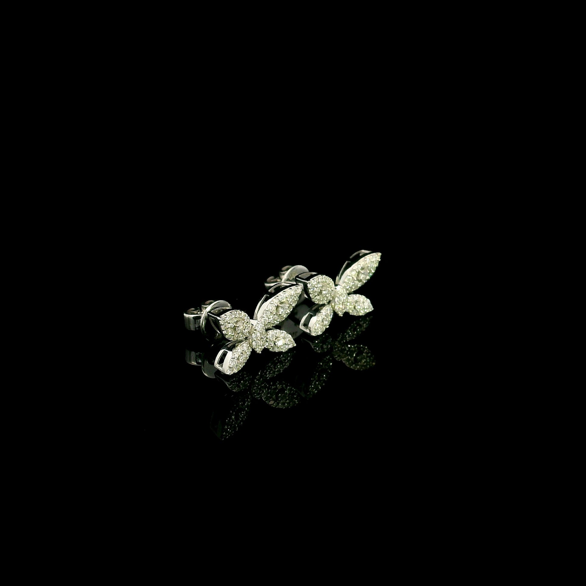 18K white gold butterfly stud earrings featuring 0.45 carat natural round brilliant diamonds in a pavé setting with secure butterfly backs.