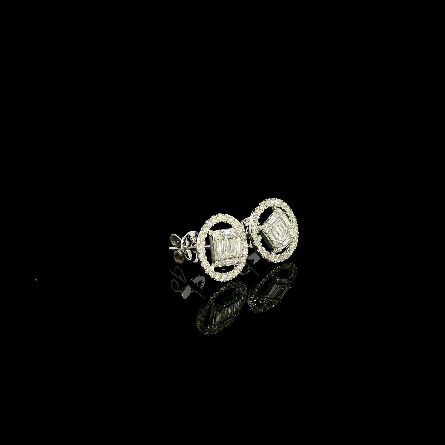 18K white gold emerald cut illusion diamond stud earrings featuring round and baguette natural diamonds with a sparkling round diamond halo and secure butterfly backs.