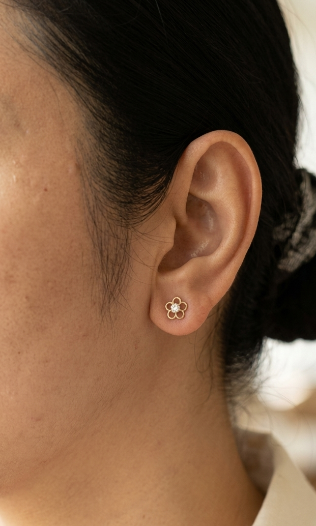 18K yellow gold flower diamond stud earrings featuring round brilliant natural diamonds in a delicate open floral design.