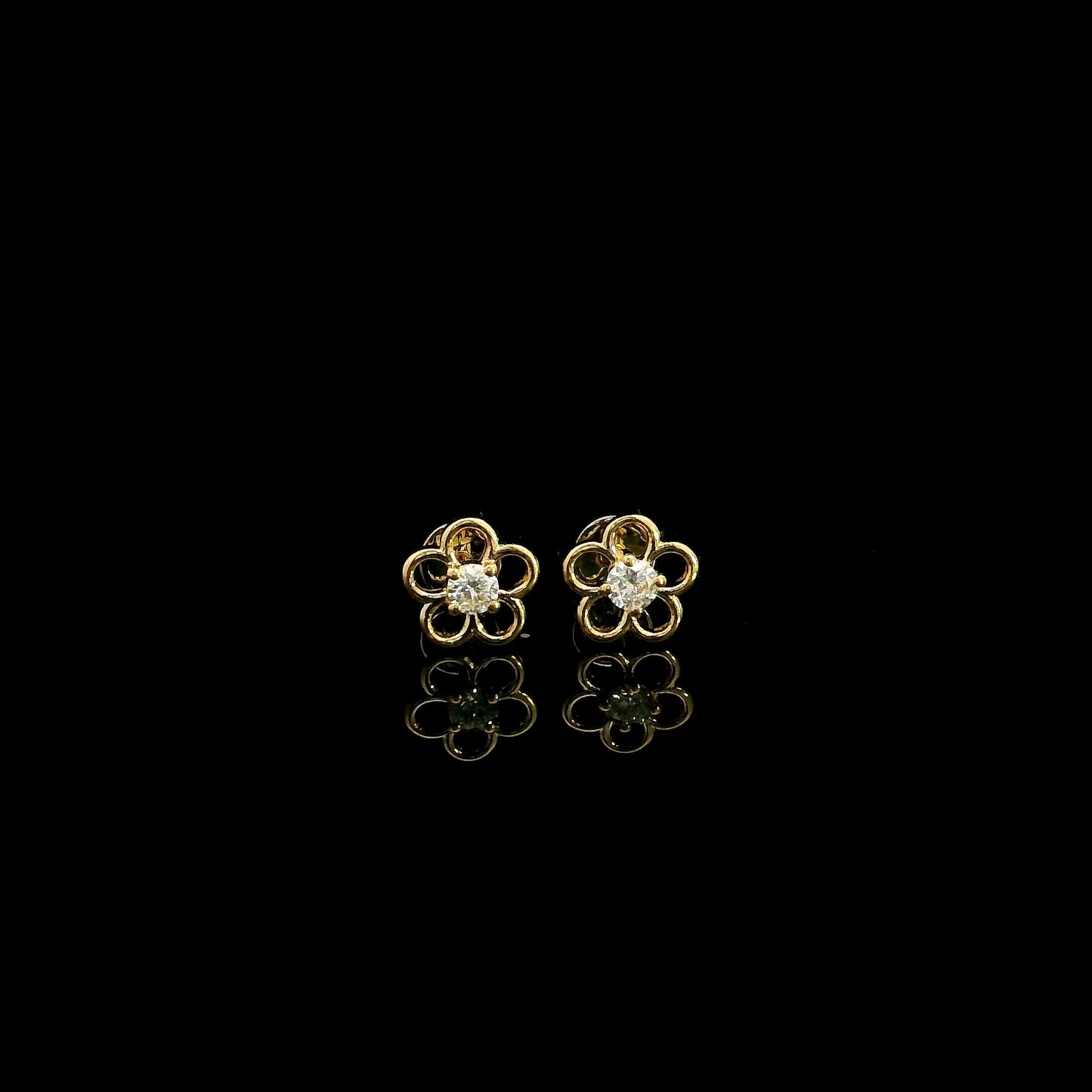 18K yellow gold flower diamond stud earrings featuring round brilliant natural diamonds in a delicate open floral design.
