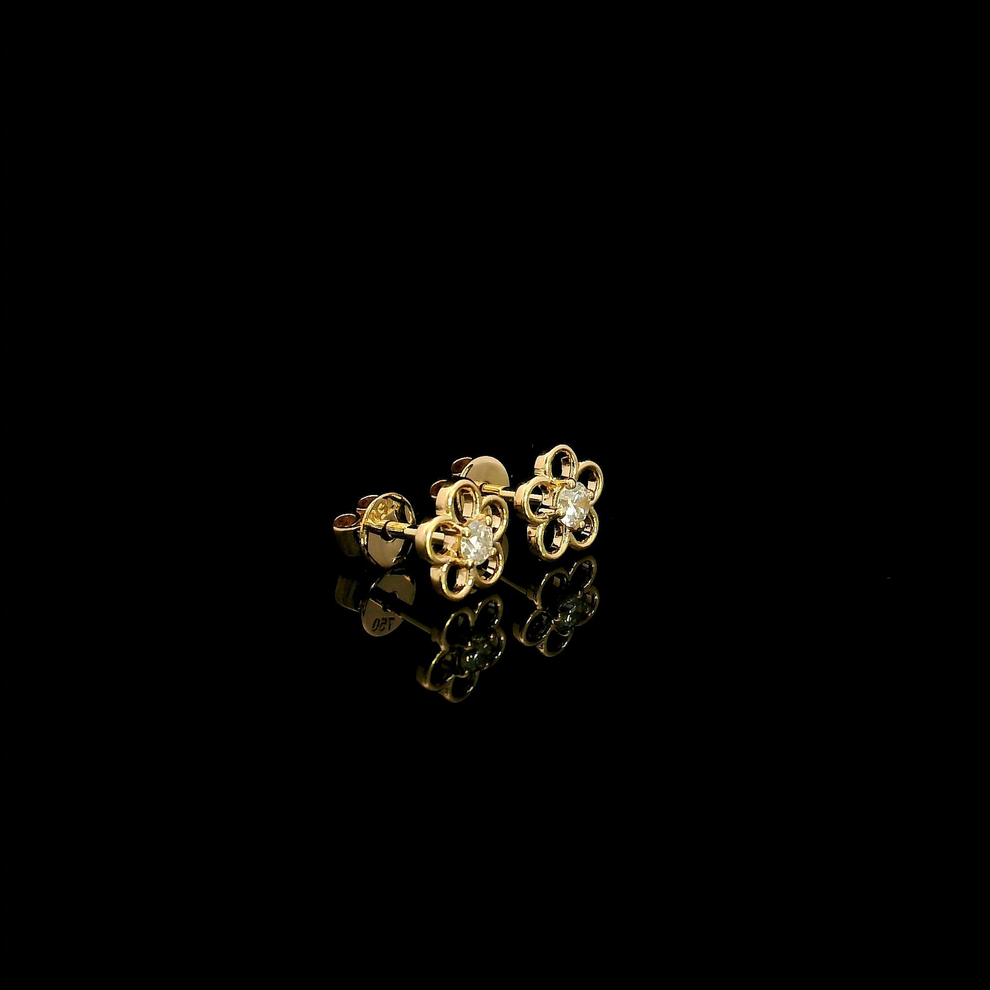 18K yellow gold flower diamond stud earrings featuring round brilliant natural diamonds in a delicate open floral design.