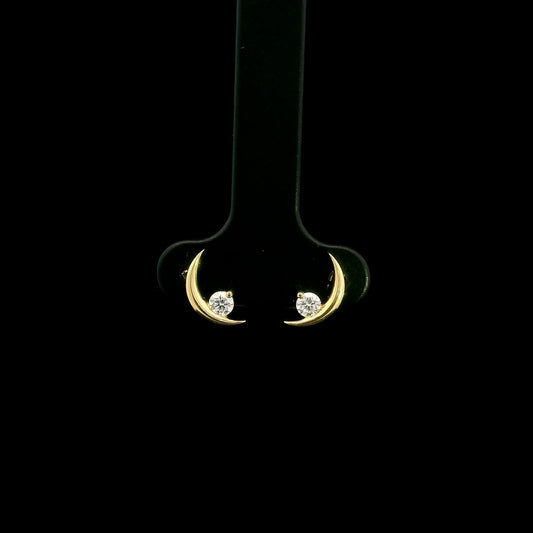 18K yellow gold crescent moon stud earrings featuring 0.17 carat natural round brilliant diamonds with secure butterfly push backs.