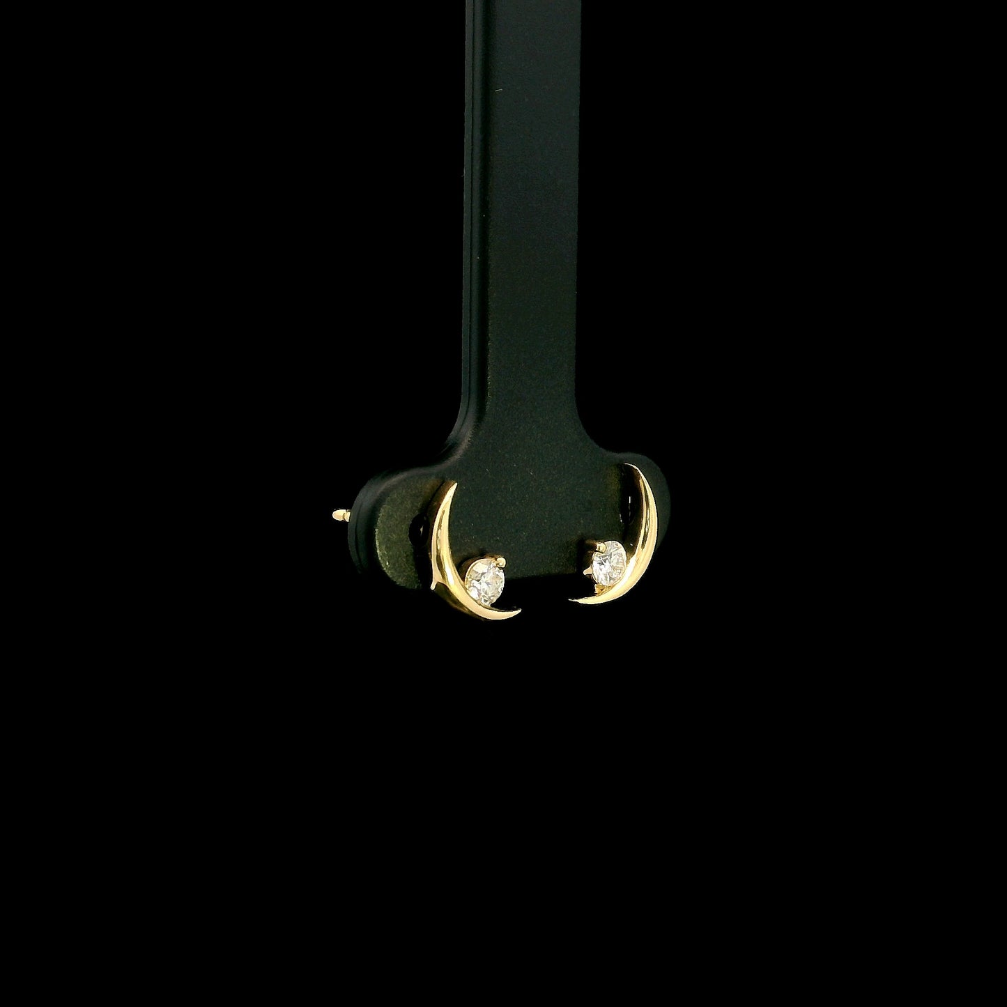 18K yellow gold crescent moon stud earrings featuring 0.17 carat natural round brilliant diamonds with secure butterfly push backs.