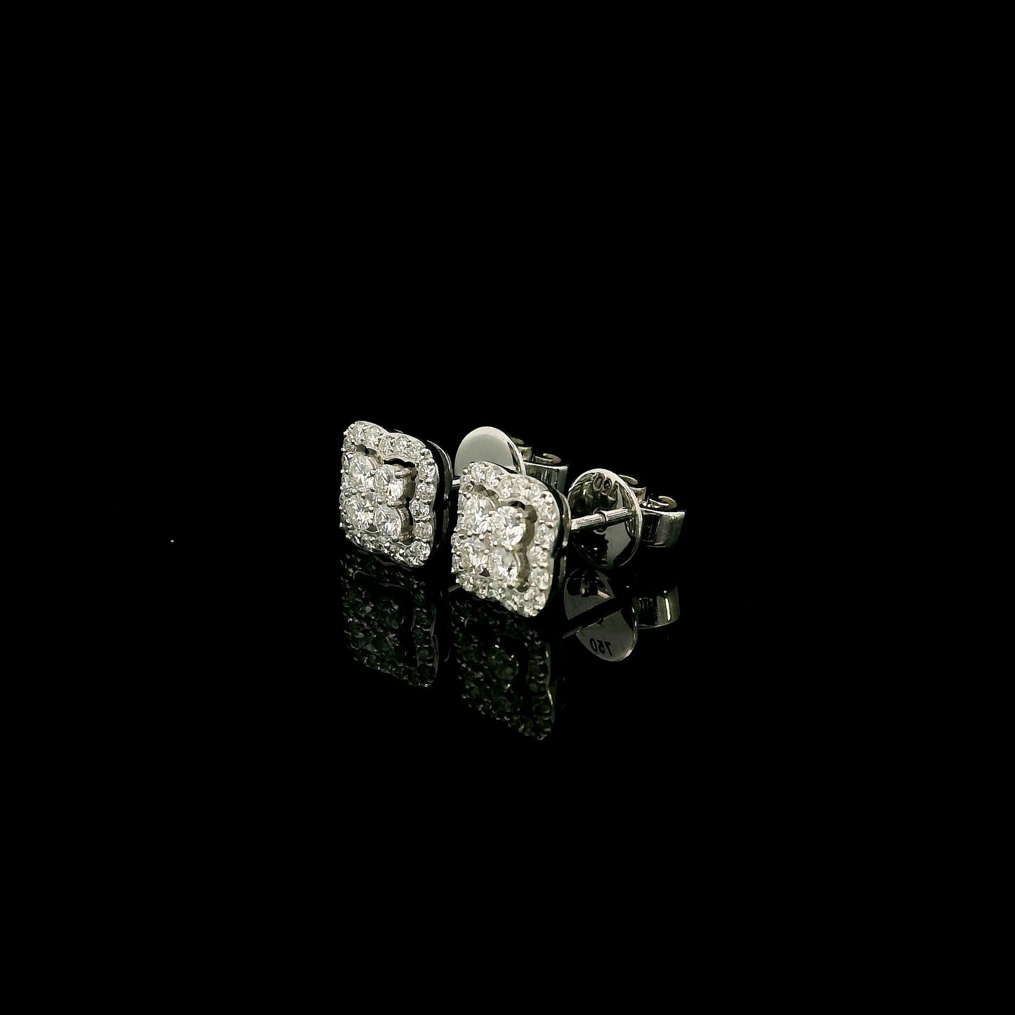 18K white gold cushion halo diamond stud earrings featuring 0.44 carat natural round brilliant diamonds in a sparkling cluster design with secure butterfly backs.