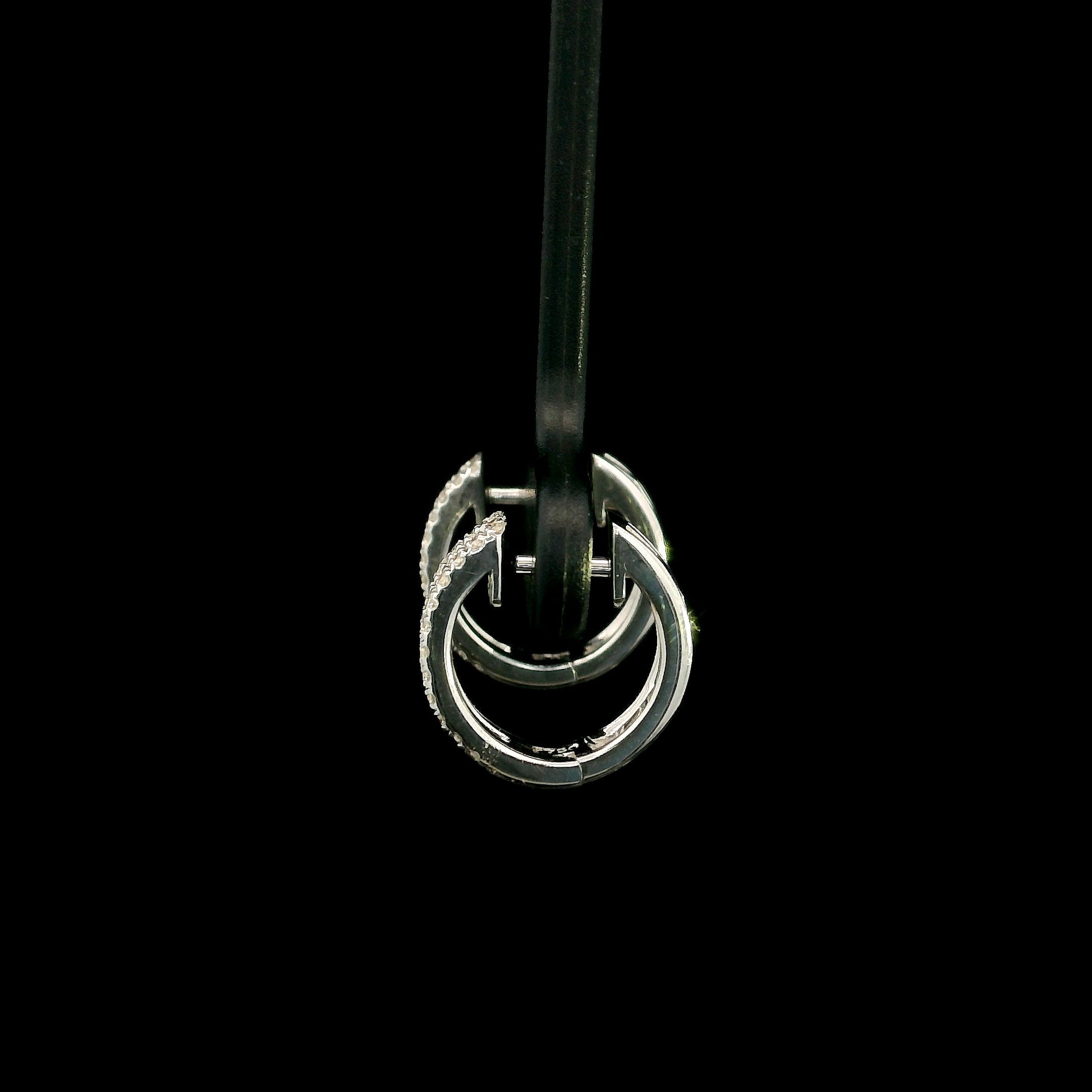 18K white gold diamond huggie hoop earrings featuring 0.23 carat natural round brilliant pavé-set diamonds in a modern double-row design with a secure hinged closure.