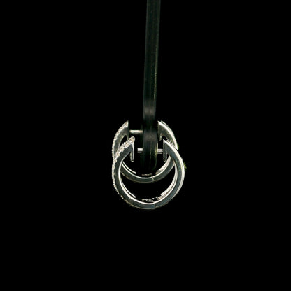 18K white gold diamond huggie hoop earrings featuring 0.23 carat natural round brilliant pavé-set diamonds in a modern double-row design with a secure hinged closure.