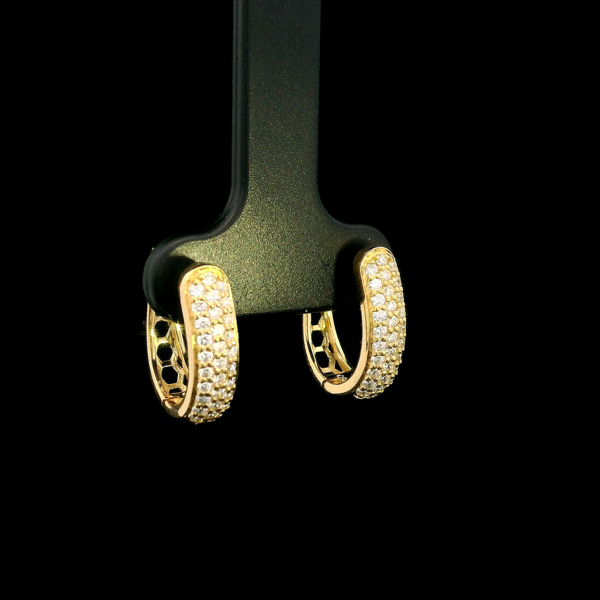 18K yellow gold diamond huggie hoop earrings featuring 0.51 carat natural round brilliant pavé-set diamonds with a secure hinged closure.