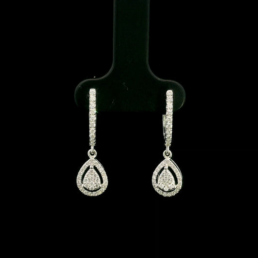 18K white gold pear diamond drop earrings featuring 0.44 carat natural diamonds with diamond-set huggie hoops and open pear halo design.