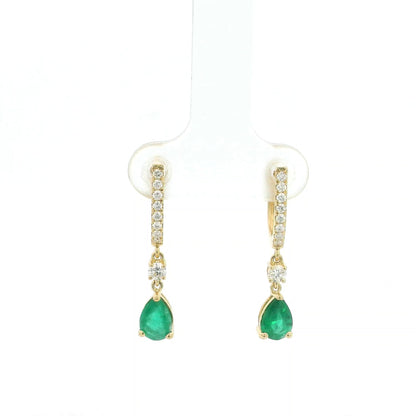 18K Yellow Gold Emerald Drop Earrings featuring 1.00 carat natural pear-shaped emeralds suspended from diamond huggie hoops with 0.31 carat natural diamonds.