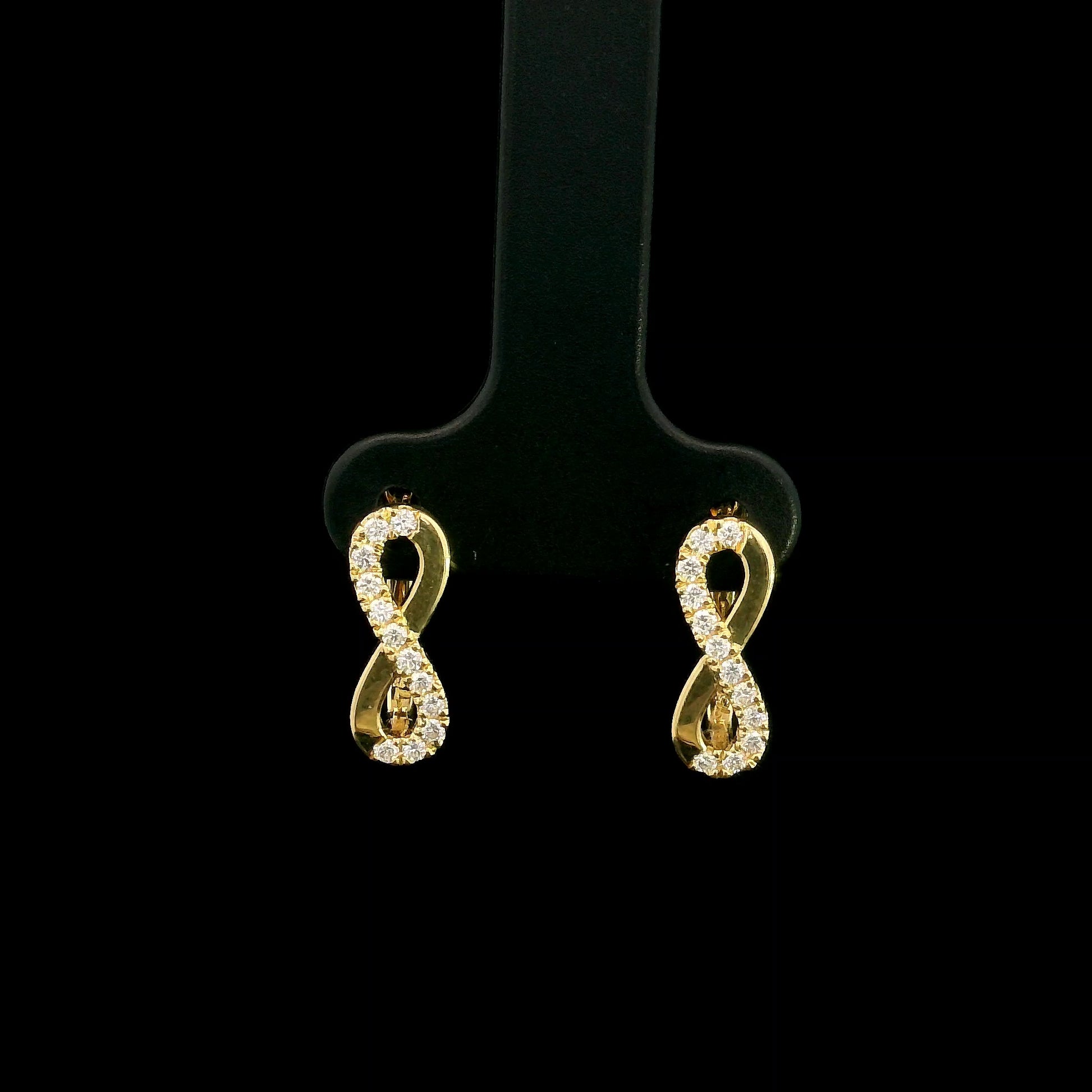 18K yellow gold infinity diamond earrings featuring natural round brilliant diamonds in a pavé setting with a total diamond weight of 0.22 carat.
