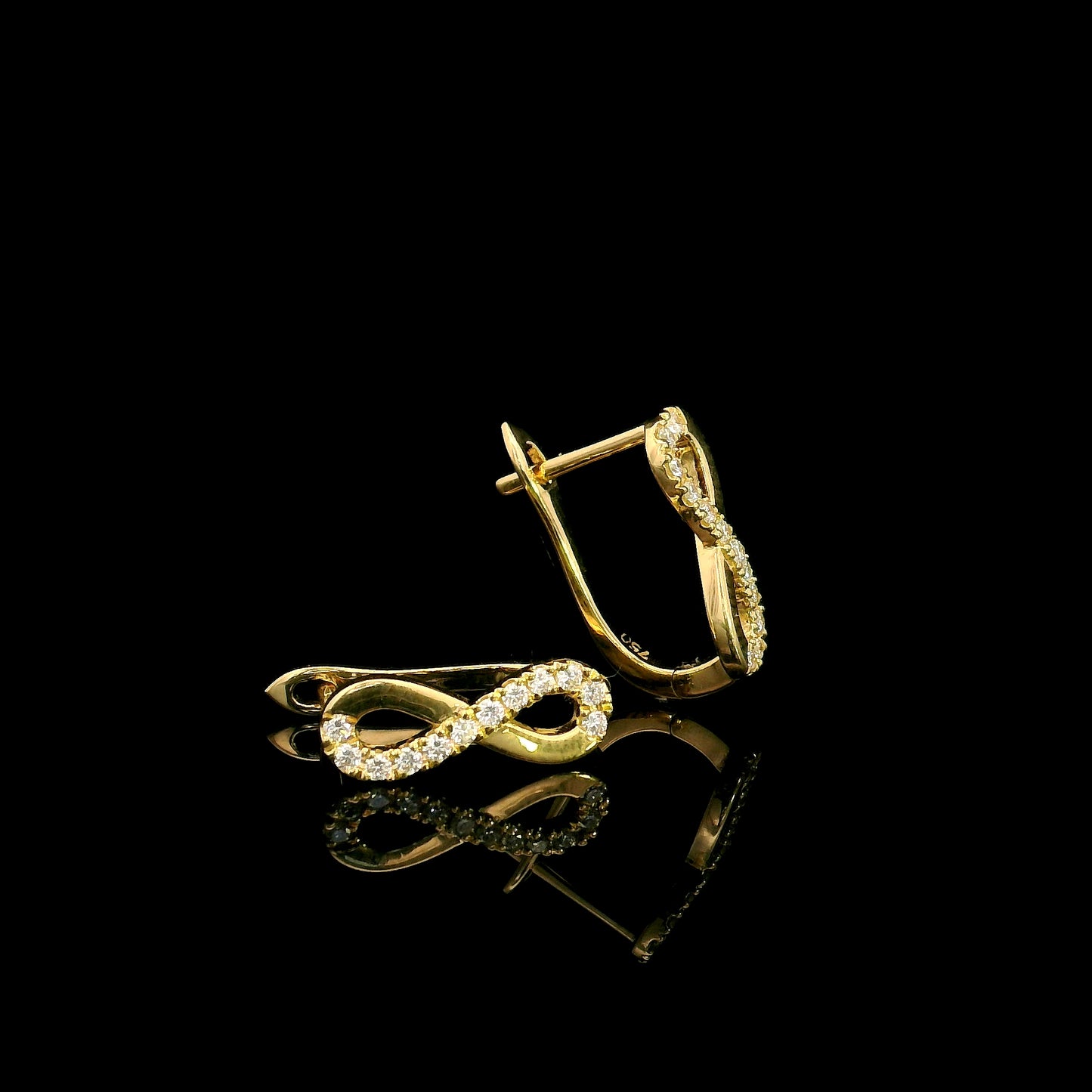 18K yellow gold infinity diamond earrings featuring natural round brilliant diamonds in a pavé setting with a total diamond weight of 0.22 carat.