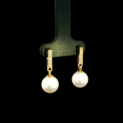 Freshwater pearl and diamond drop earrings in 18K yellow gold with diamond-set bar detail
