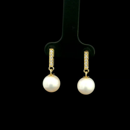 Freshwater pearl and diamond drop earrings in 18K yellow gold with diamond-set bar detail