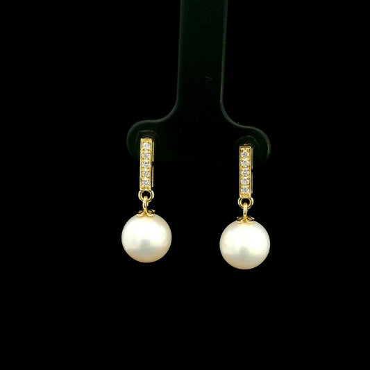 Freshwater pearl and diamond drop earrings in 18K yellow gold with diamond-set bar detail