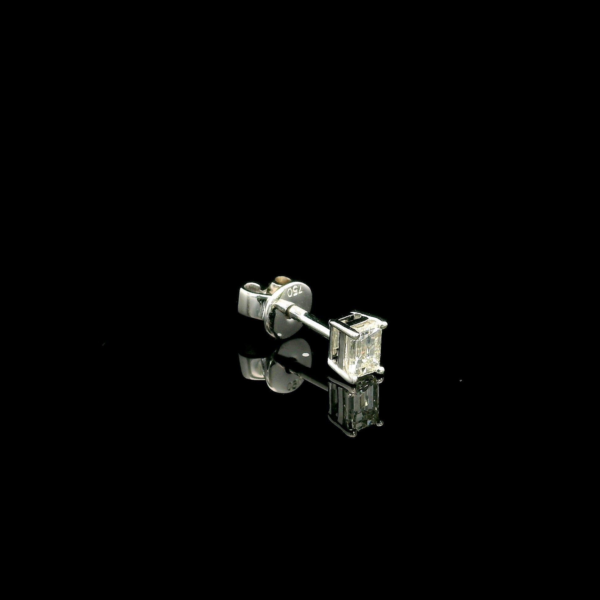 Emerald cut diamond single stud earring in 18K white gold with 0.25 carat natural diamond
