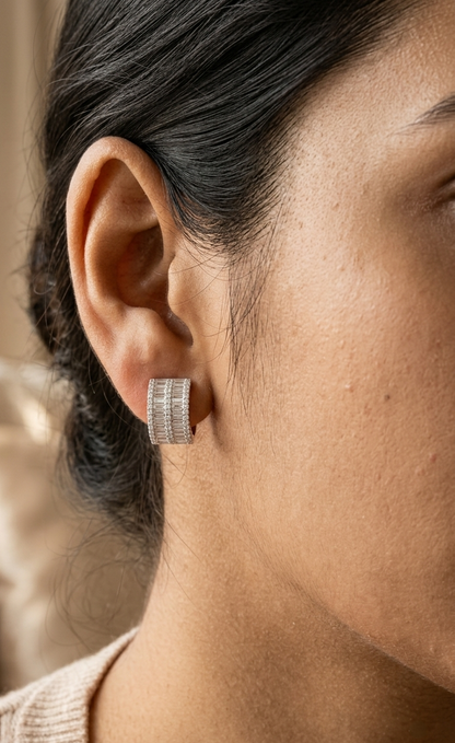 18K white gold baguette and round diamond huggie hoop earrings with multi-row diamond design