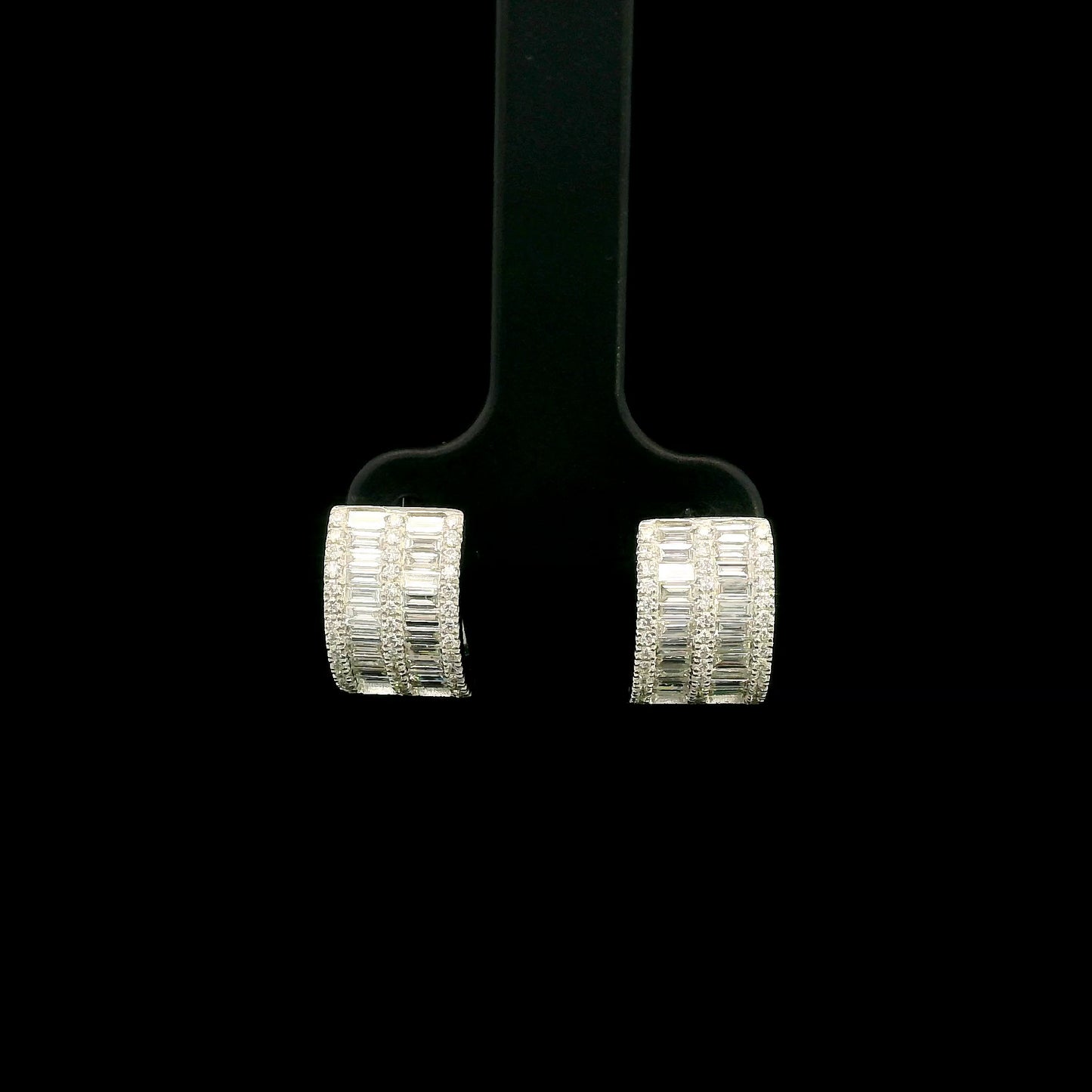 18K white gold baguette and round diamond huggie hoop earrings with multi-row diamond design