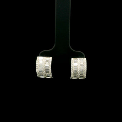 18K white gold baguette and round diamond huggie hoop earrings with multi-row diamond design