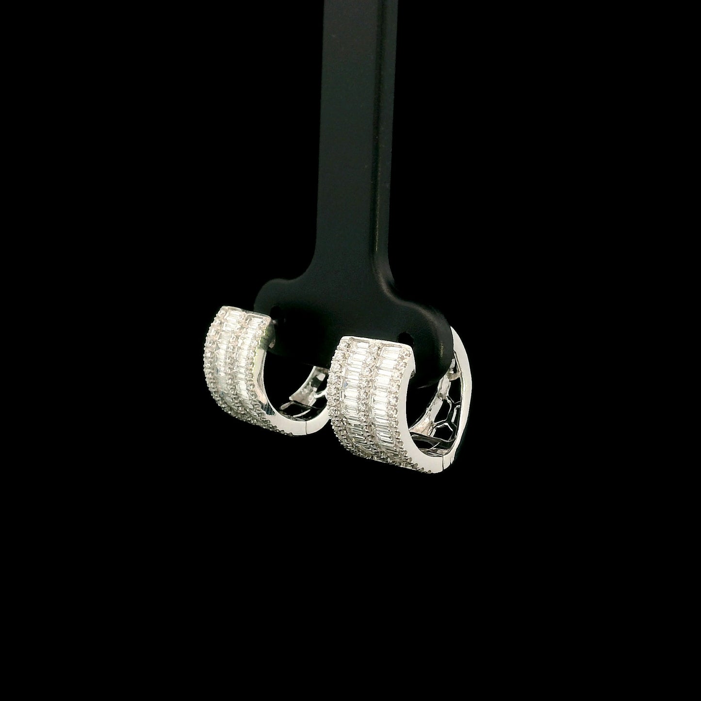 18K white gold baguette and round diamond huggie hoop earrings with multi-row diamond design