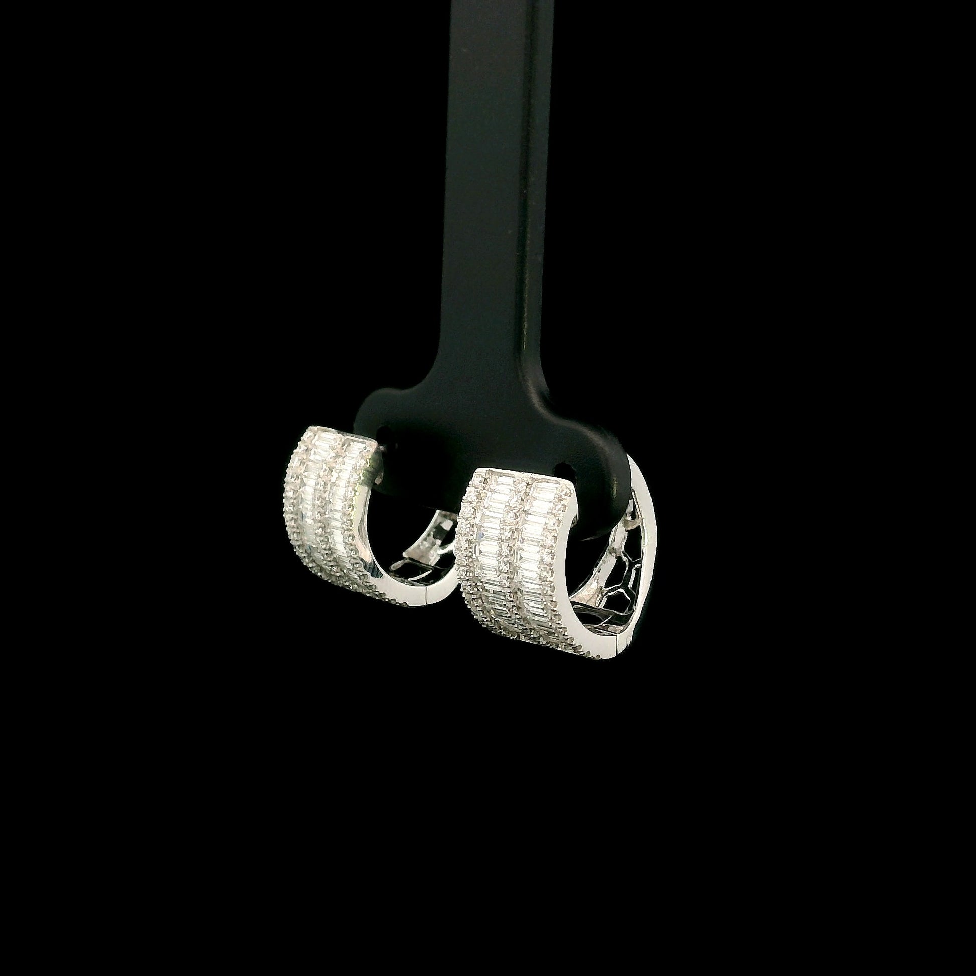 18K white gold baguette and round diamond huggie hoop earrings with multi-row diamond design