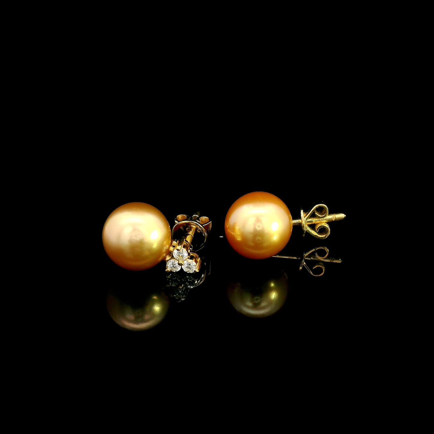 South Sea golden pearl and diamond stud earrings in 18K yellow gold with 8 x 8.5 mm pearls and three-diamond accents