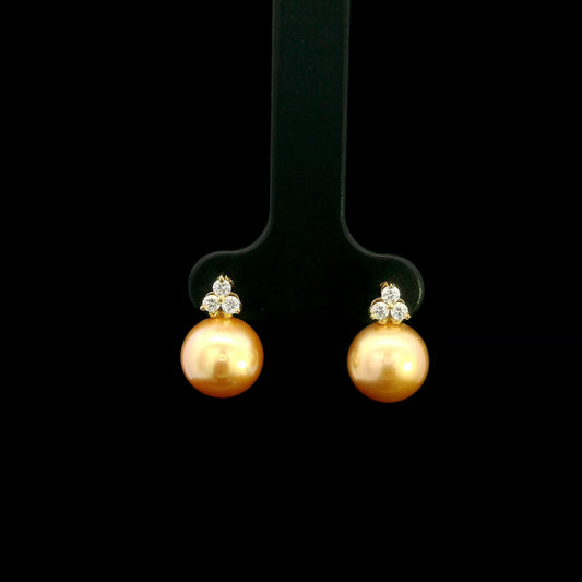 South Sea golden pearl and diamond stud earrings in 18K yellow gold with 8 x 8.5 mm pearls and three-diamond accents