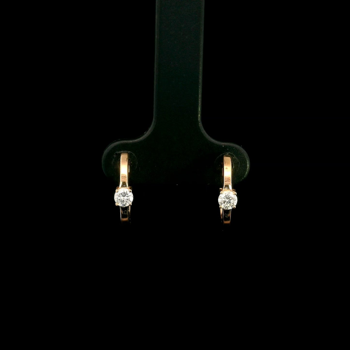18K rose gold diamond huggie hoop earrings with round solitaire diamonds