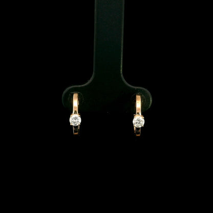 18K rose gold diamond huggie hoop earrings with round solitaire diamonds