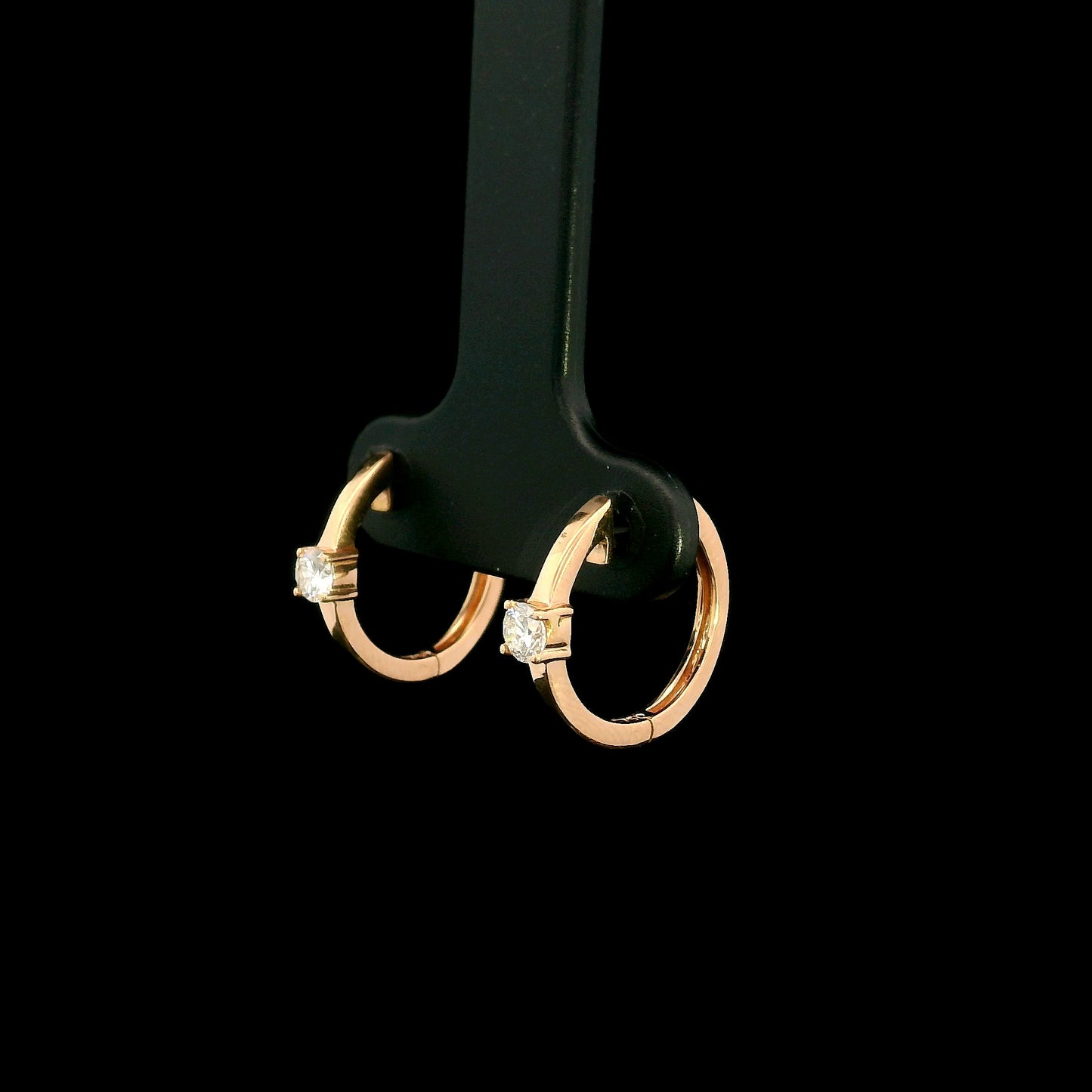 18K rose gold diamond huggie hoop earrings with round solitaire diamonds