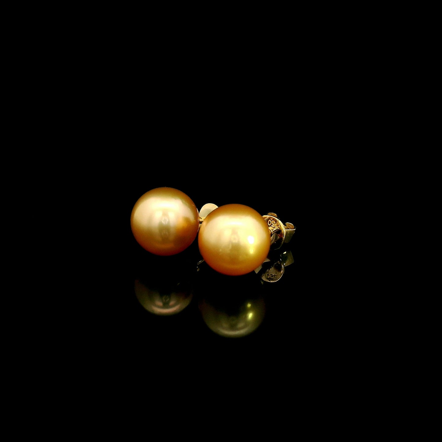 South Sea golden pearl stud earrings in 18K yellow gold with luminous round golden pearls