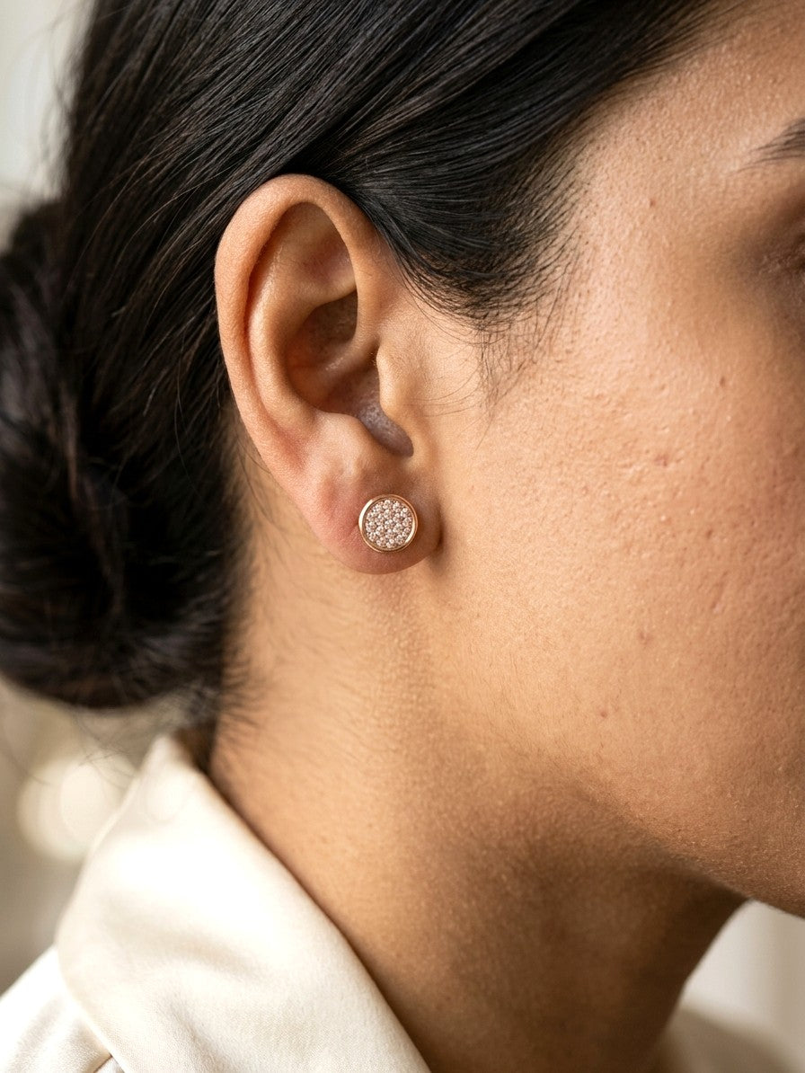 Round diamond cluster stud earrings in 18K rose gold with multiple round diamonds and polished gold border