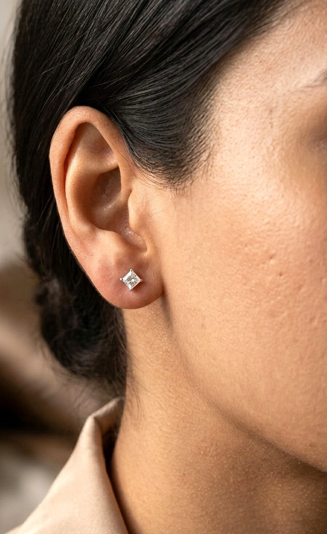 Princess cut diamond stud earrings in 18K white gold with 0.58 carat total natural diamond weight