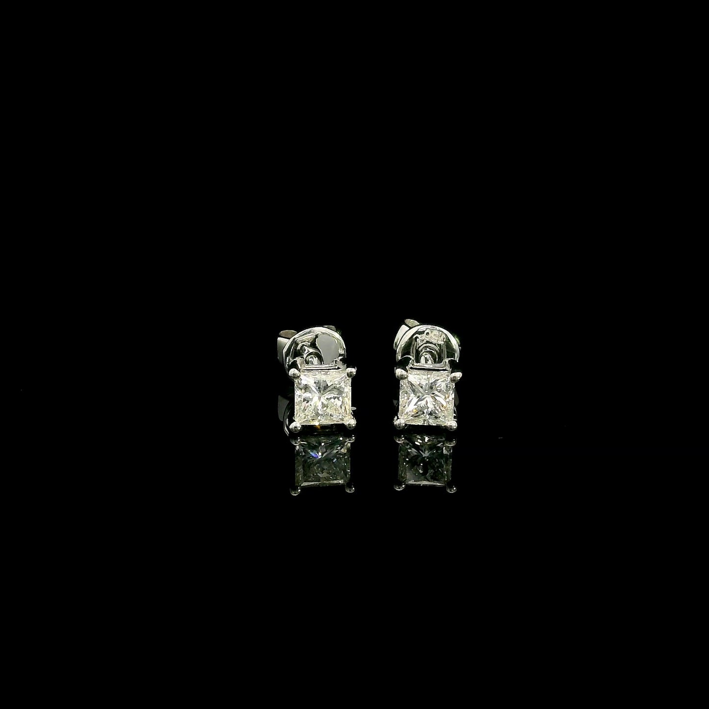Princess cut diamond stud earrings in 18K white gold with 0.58 carat total natural diamond weight