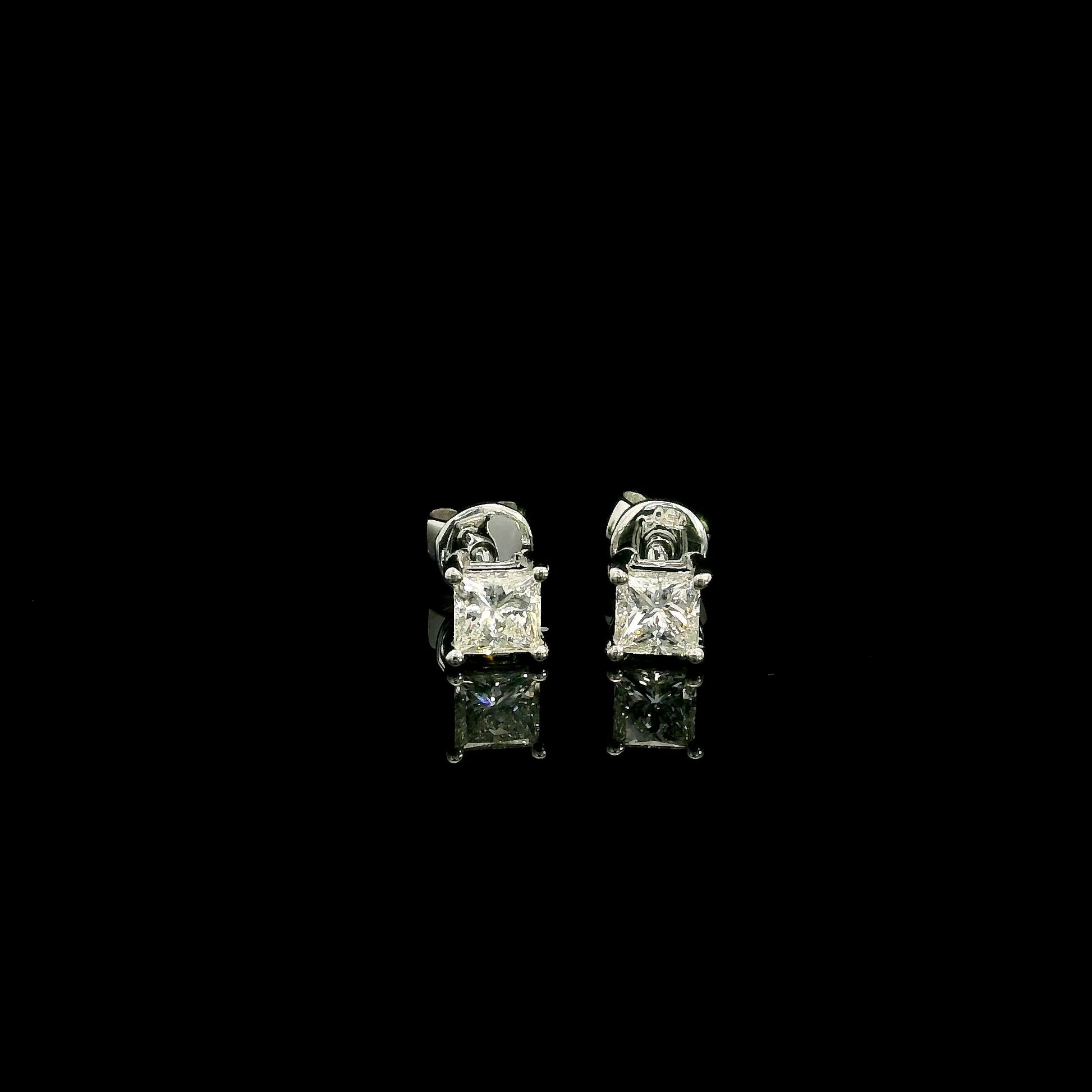 Princess cut diamond stud earrings in 18K white gold with 0.58 carat total natural diamond weight