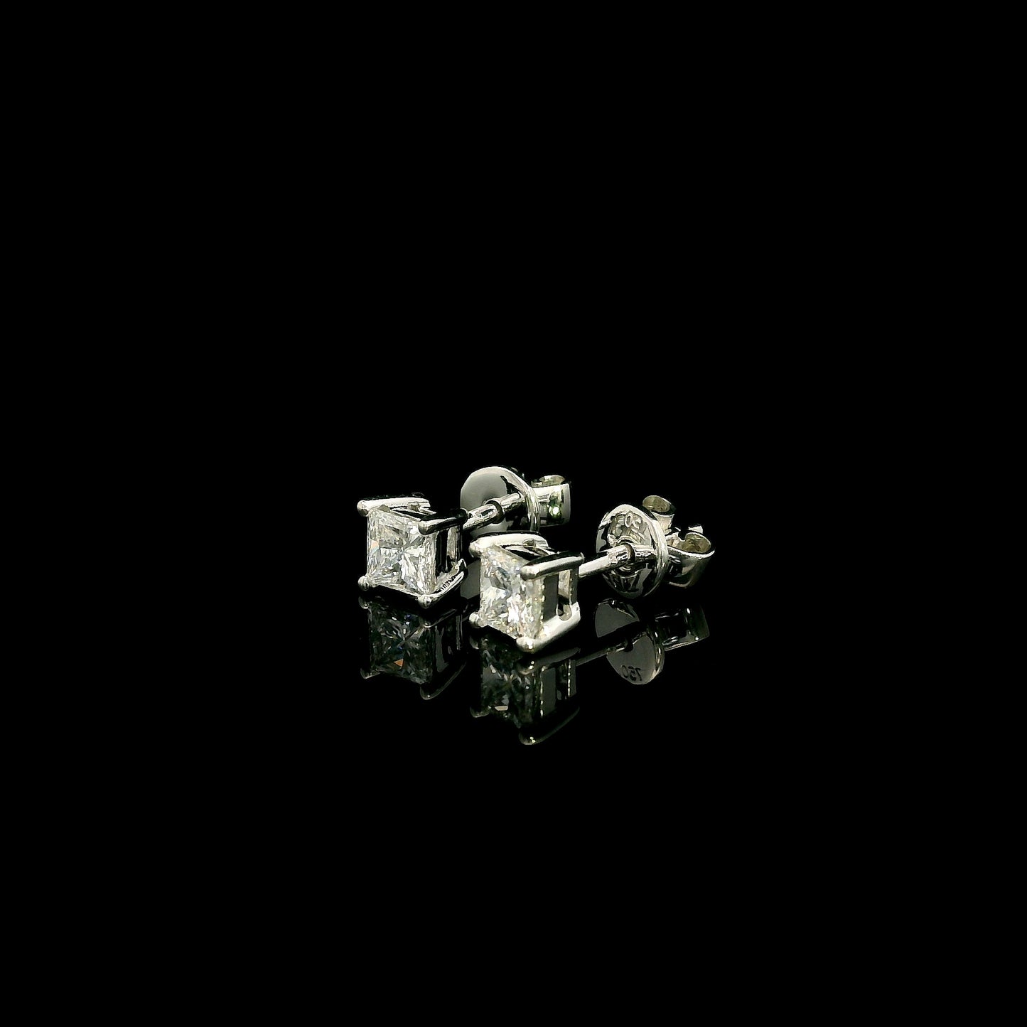 Princess cut diamond stud earrings in 18K white gold with 0.58 carat total natural diamond weight