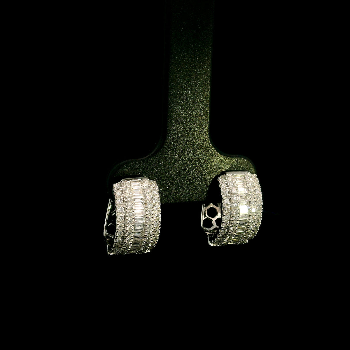 Baguette and round diamond hoop earrings in 18K white gold featuring a central baguette diamond row framed by round brilliant diamonds.