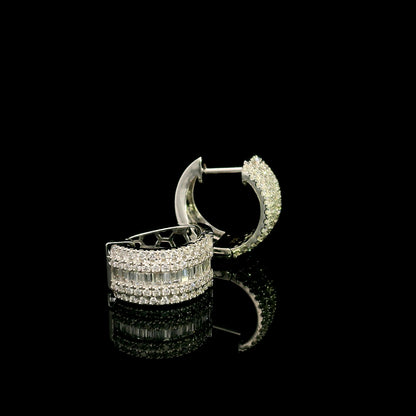 Baguette and round diamond hoop earrings in 18K white gold featuring a central baguette diamond row framed by round brilliant diamonds.