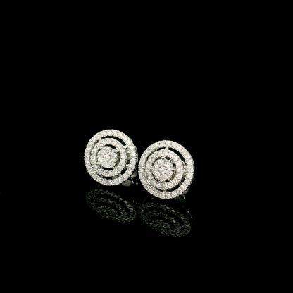 Diamond circle stud earrings in 18K white gold featuring concentric rows of round brilliant diamonds.